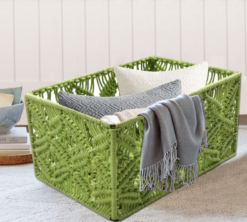 A green macrame basket that can hold a few pillows and rugs