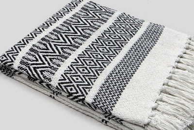 White throw with designer pattern