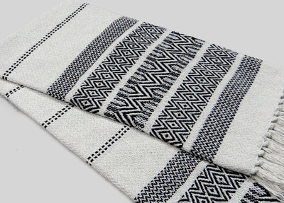 White throw with designer pattern