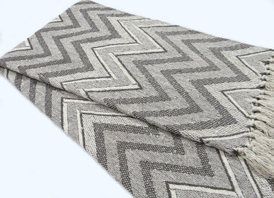Grey Throw with wavy pattern