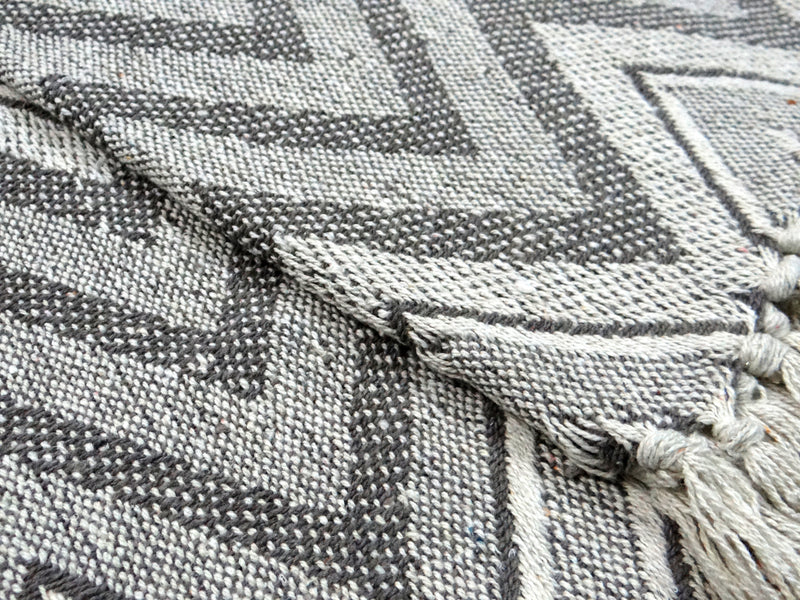 Grey Throw with wavy pattern