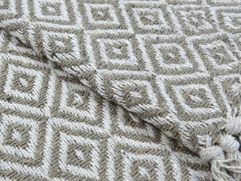 Brown throw with rhombus pattern