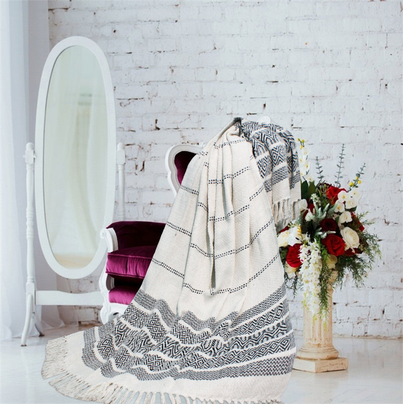 White throw with designer pattern